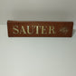 Sauter 1819 Vintage Advertising Sign