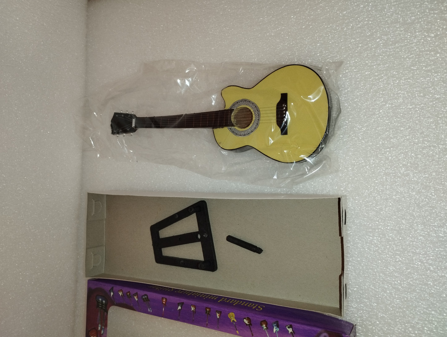 "GB" Acoustic Guitar Model

 Made of wood with plastic parts