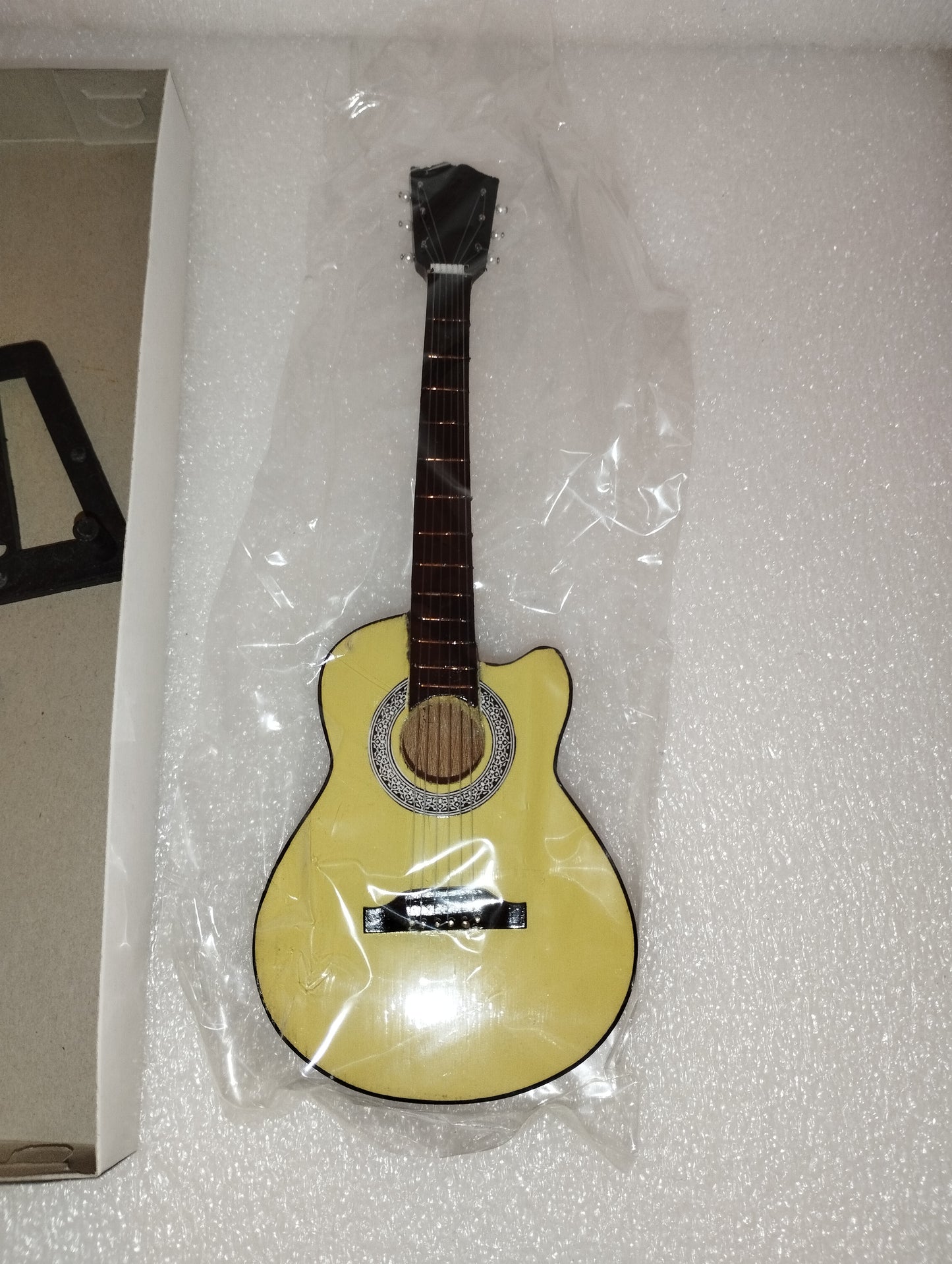 "GB" Acoustic Guitar Model

 Made of wood with plastic parts