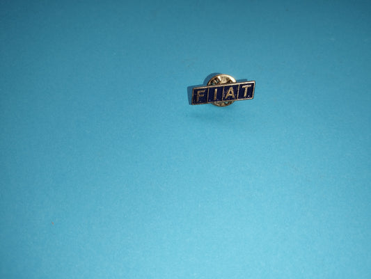 Fiat metal brooch