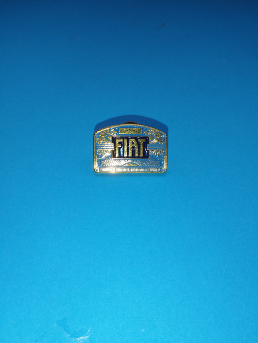 Fiat metal brooch