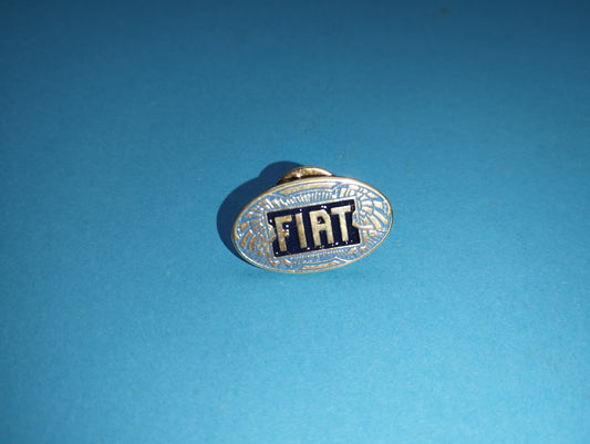 Fiat metal brooch