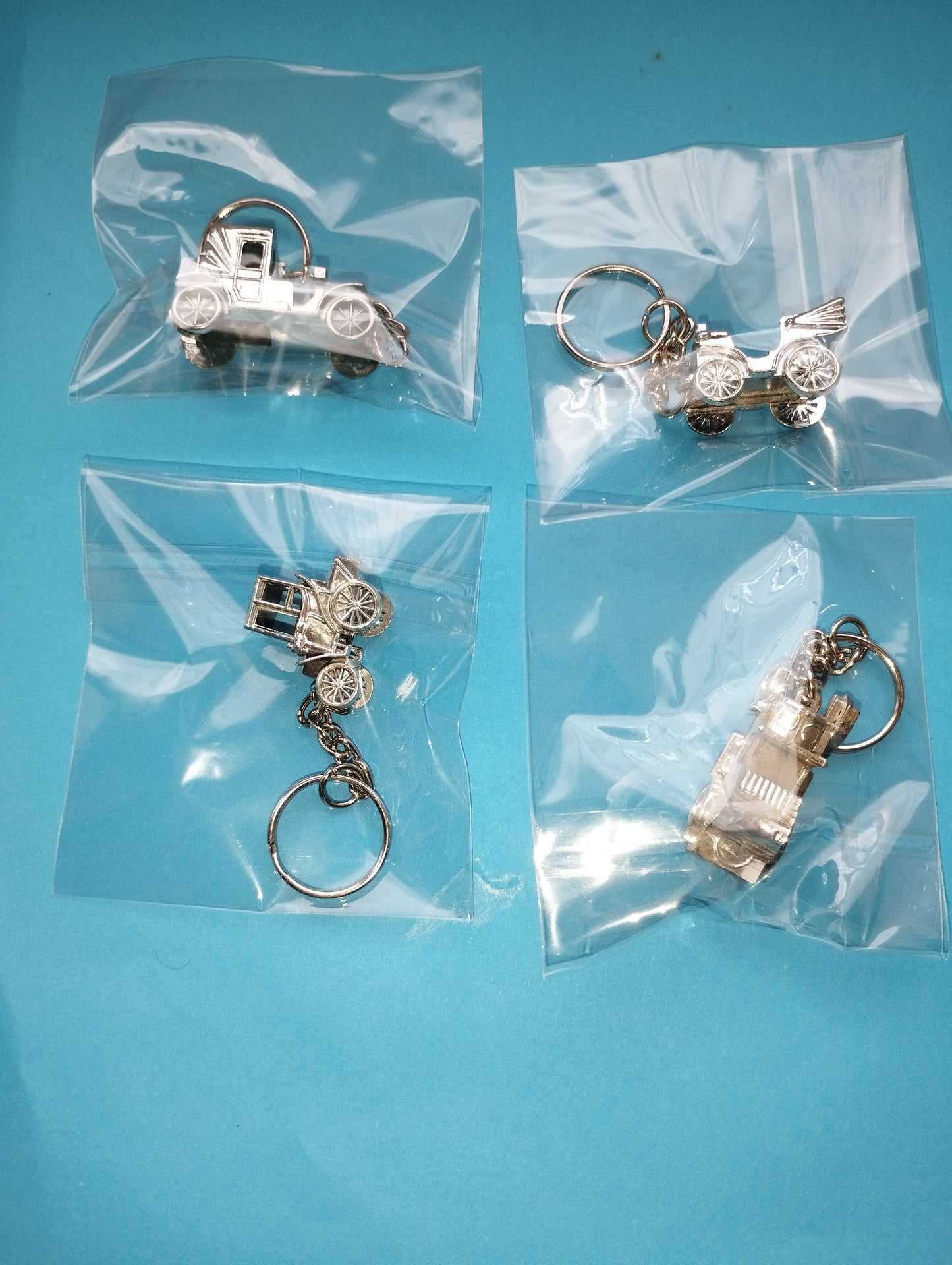 Lot of 4 vintage car key rings