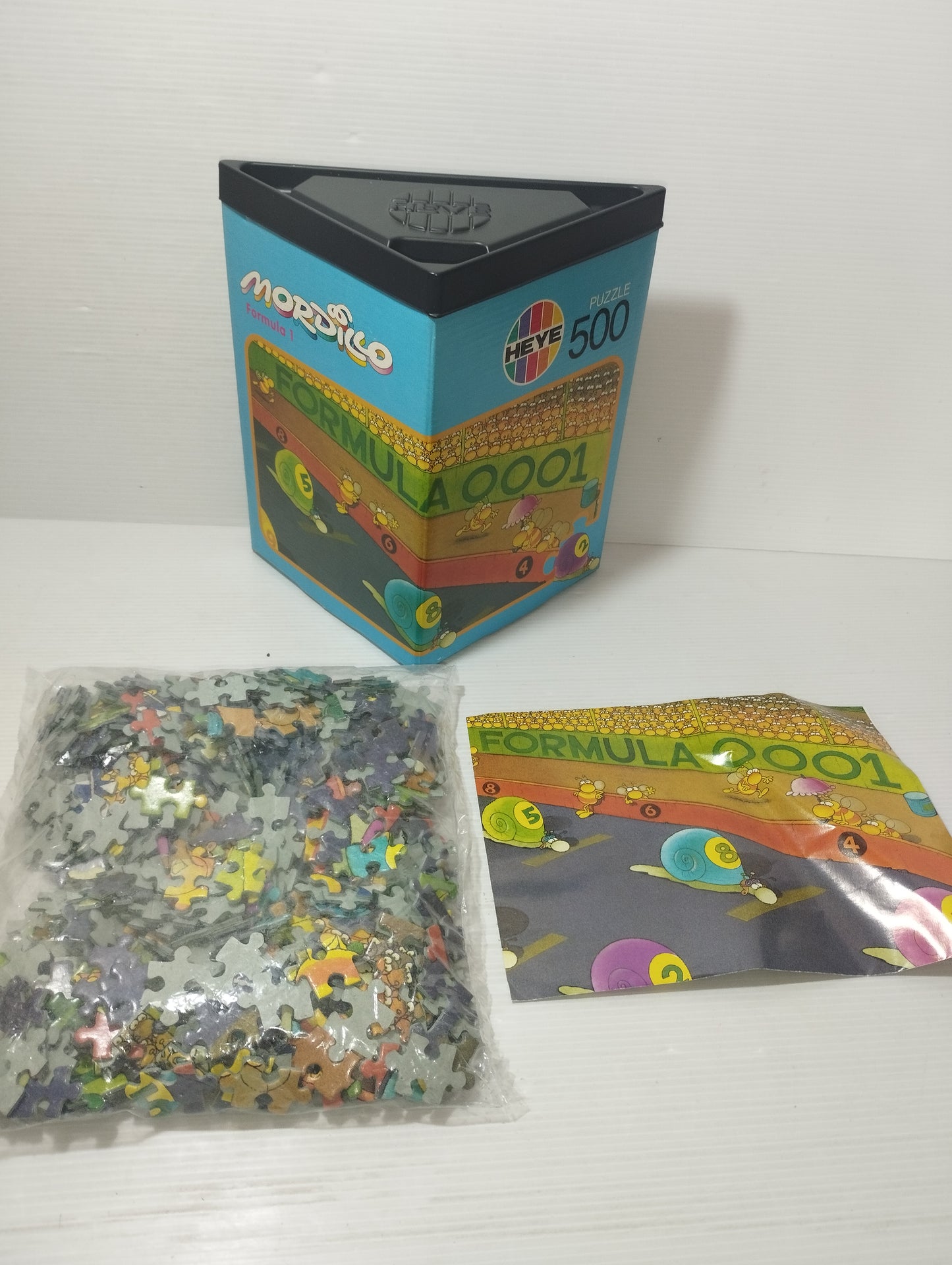 Mordillo Formula 1 Puzzle 500 Pezzi Prodotto da Heye art Nr 8364
Vintage anni 90