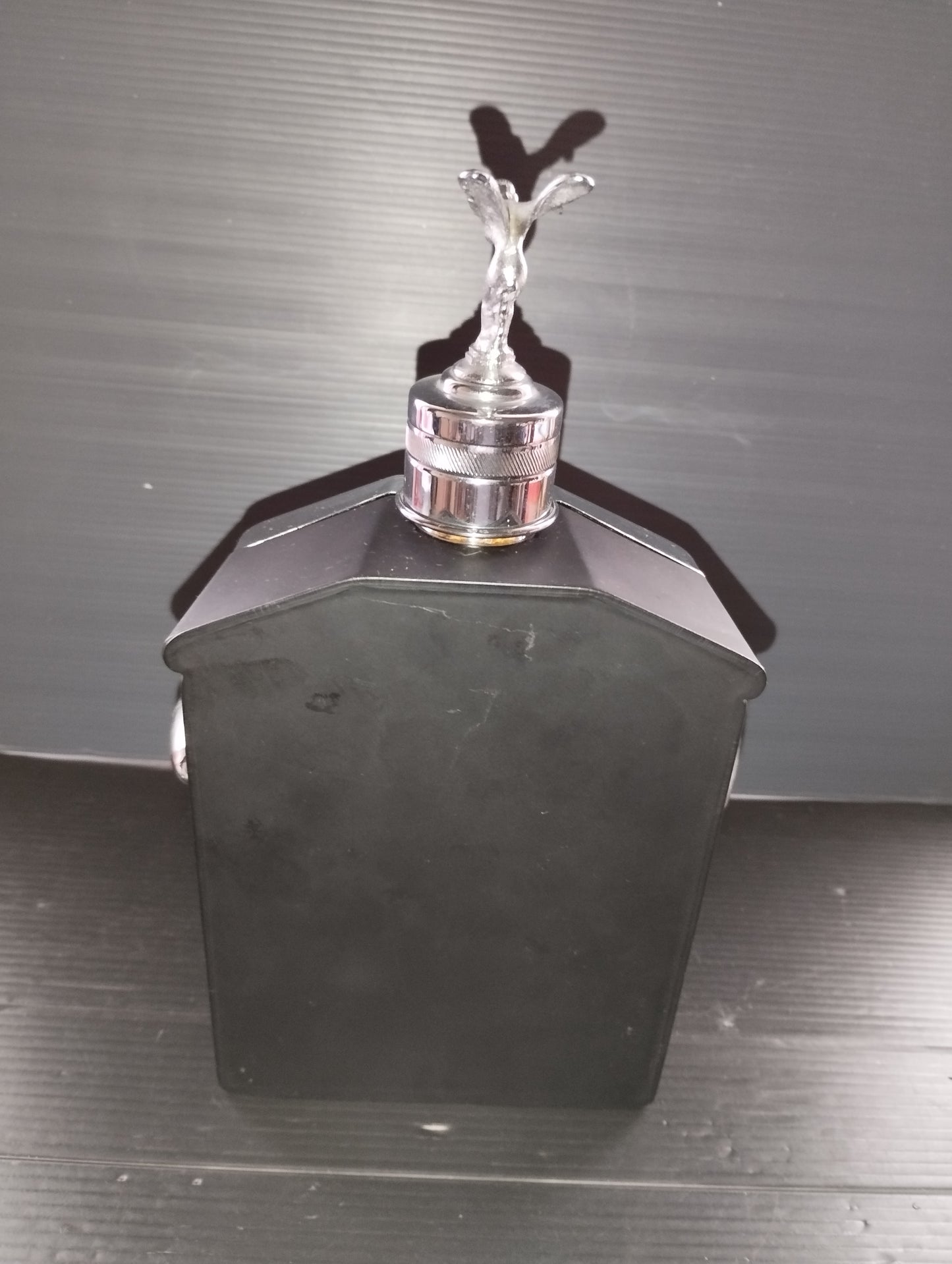 Bottle in the shape of a Rolls Royce Radiator with Music Box

 Original from the 60s