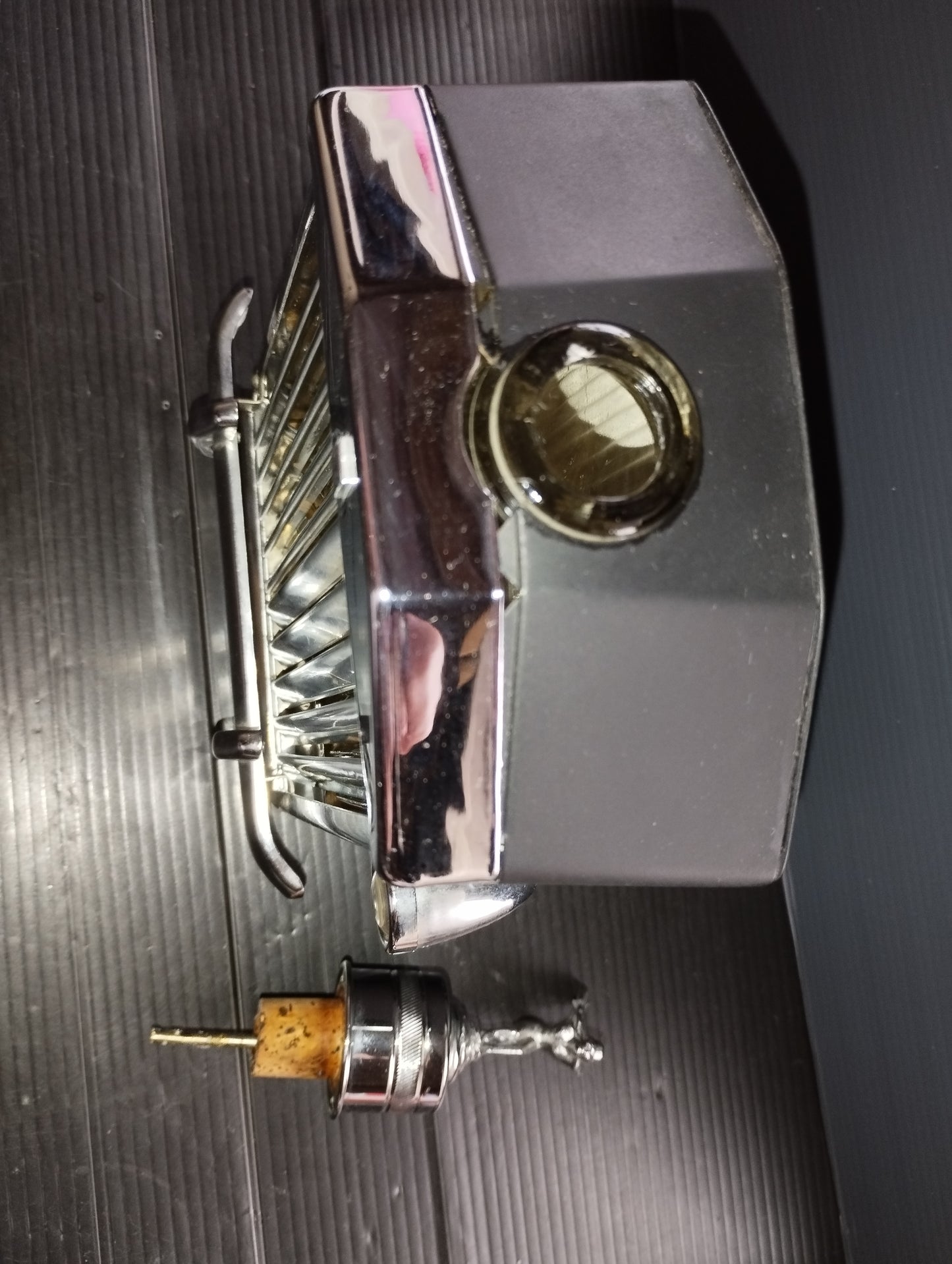 Bottle in the shape of a Rolls Royce Radiator with Music Box

 Original from the 60s