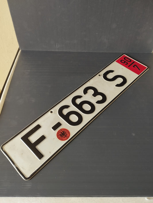 German vehicle license plate

 90's

 Metal