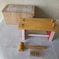 Vintage wooden banquet game for children with hammer and pegs