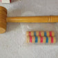 Vintage wooden banquet game for children with hammer and pegs